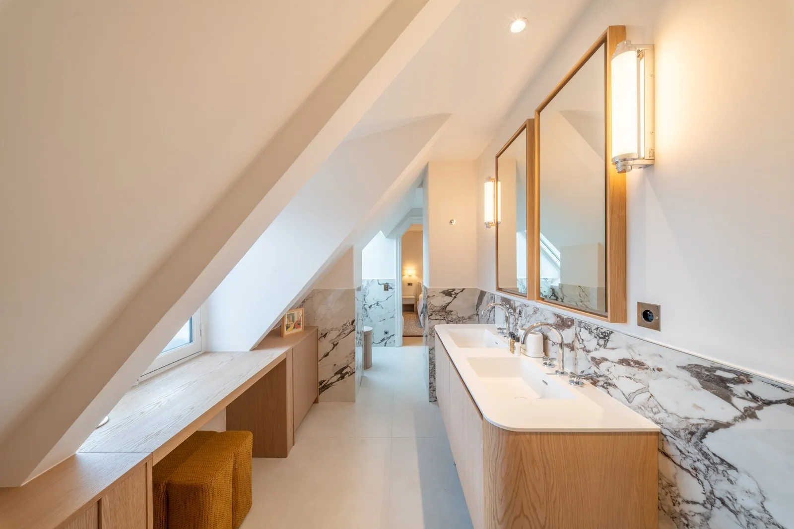 Blackdoor Paris — marble bathroom under the eaves.