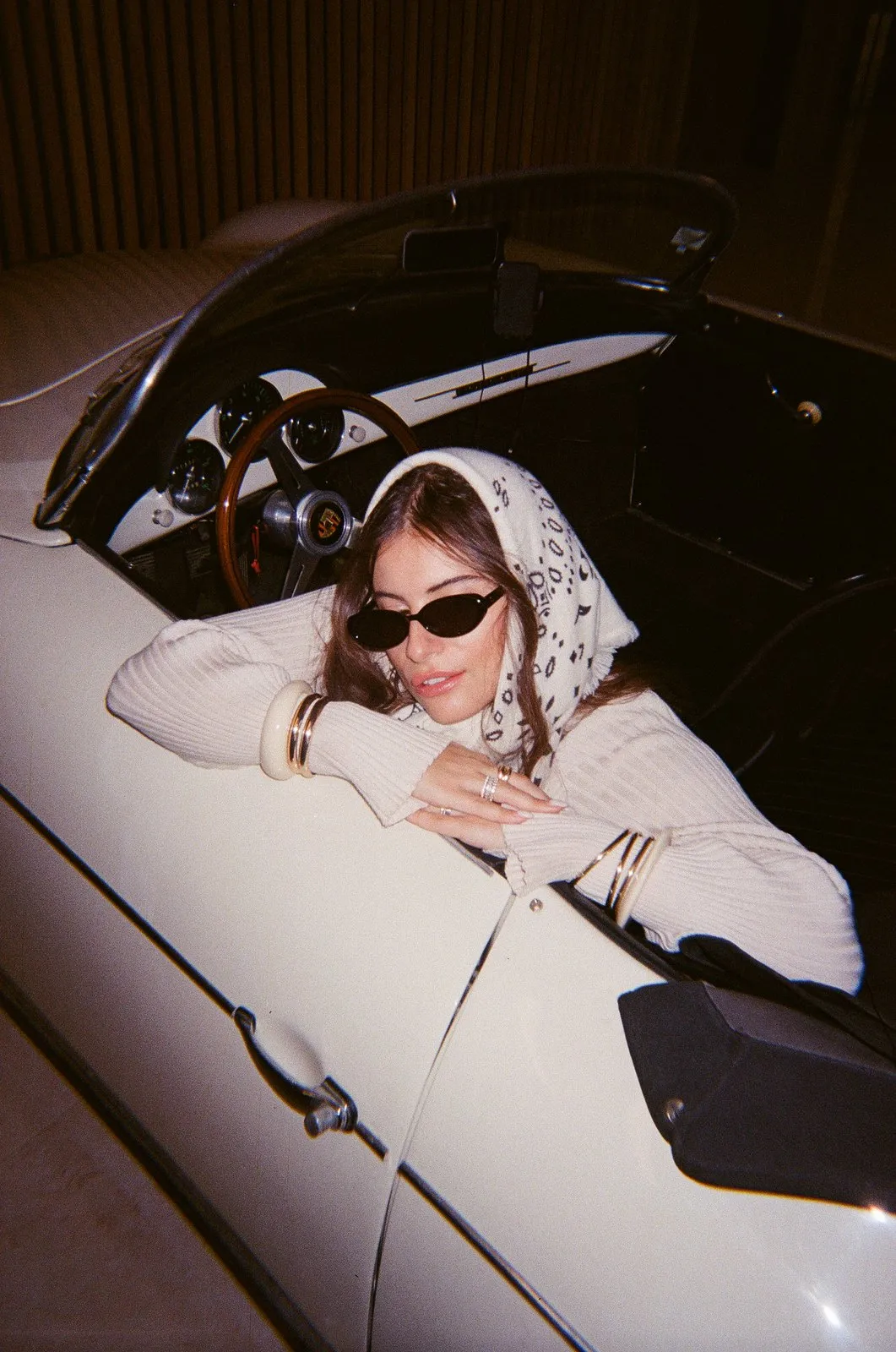 Bo House — leaning out of a white convertible